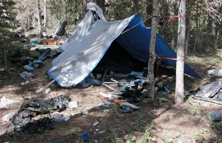 This undated photo provided by the Iron County Sheriff's Office shows , a remote camp littered with supplies and trash in the southern Utah wildness near Zion National Park. Authorities believe the camp was left behind by a suspect in more than two dozen burglaries of mountain cabins over an area of roughly 1,000 square miles for the past five years. (AP Photo/Iron County Sheriff)